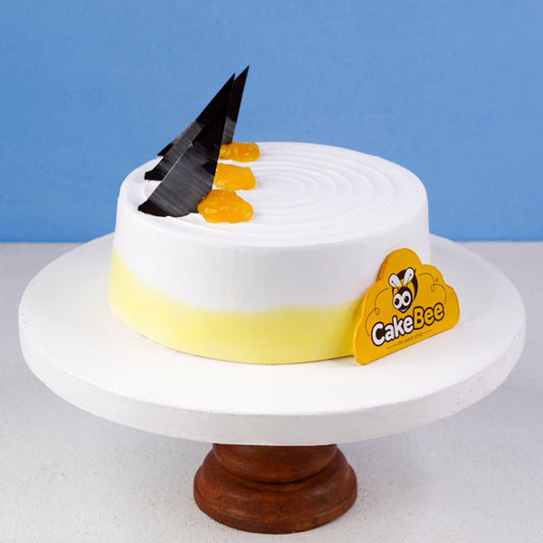 Buy Half Kg Yellow Vanilla Pineapple Cake Online - GiftMyEmotions